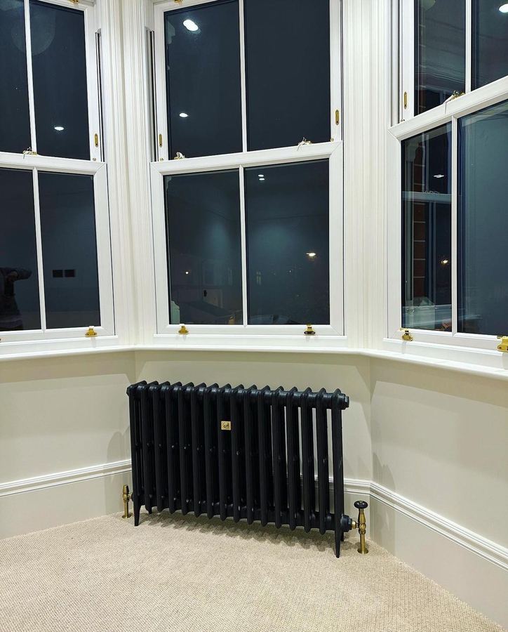 Cast iron radiator in a bay window