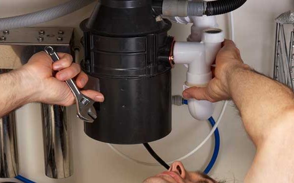 Waste disposal unit fitted under a sink
